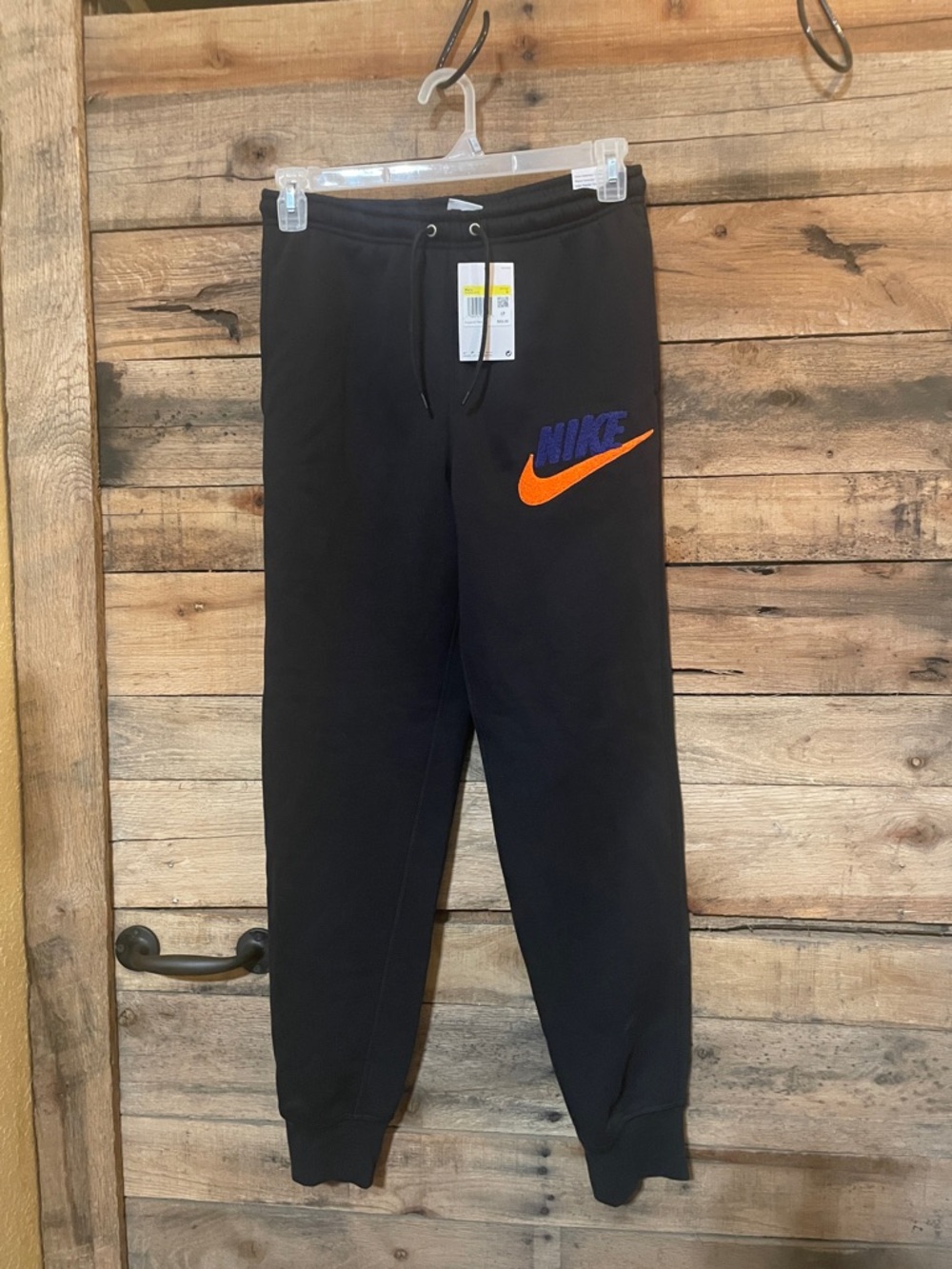 Nike Black Sweatpants with Orange Swoosh and Purple Logo